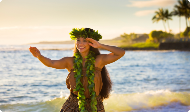 lady wearing a lei on the beach